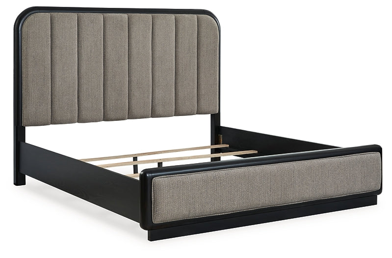 Rowanbeck King Upholstered Panel Bed with Mirrored Dresser and Chest