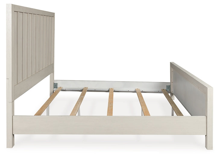 Shaybrock Queen Panel Bed with Mirrored Dresser and Chest
