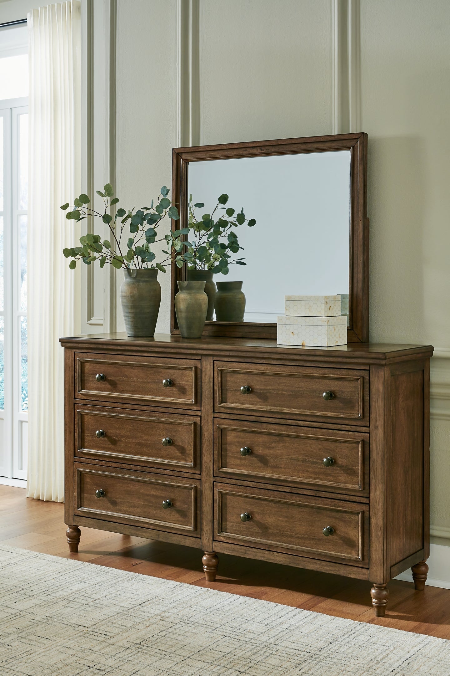 Sturlayne California King Upholstered Panel Bed with Mirrored Dresser